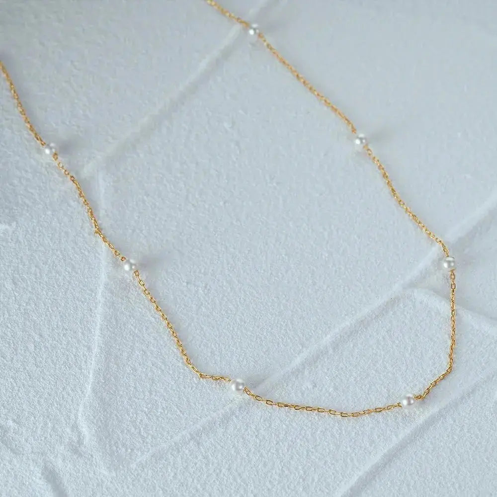 Minimalist pearl necklace shop name