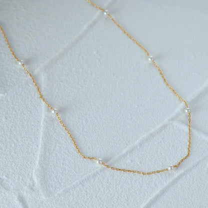 Minimalist pearl necklace shop name