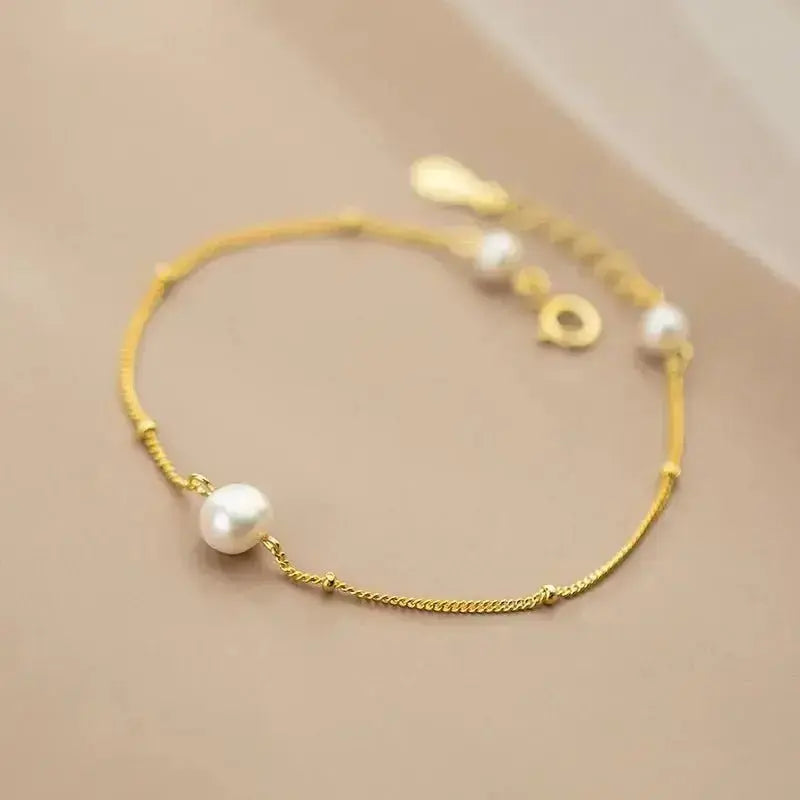 Three Pearl Vintage Vibe Gold Bracelet (small) shop name
